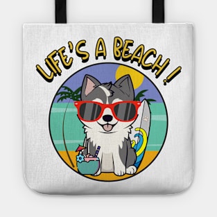 Funny husky dog is chilling on the beach Tote