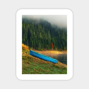 Wooden blue boat ashore autumn colors Magnet