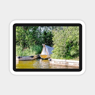 Wooden boat moored in the Norfolk Broads Magnet