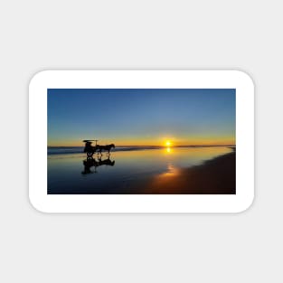 A silhouetted horse-drawn carriage on Parangtritis beach at sunset 1 Magnet