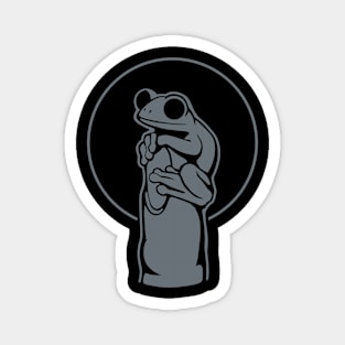 Design for amphibian lovers. Small frog on a finger. Magnet