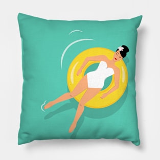 Woman sunbathing on floating rubber ring Pillow