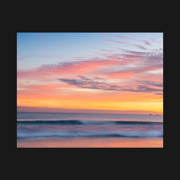 Brilliant summer sunrise along  beach with sea view and sweeping colorful cloud formations by brians101