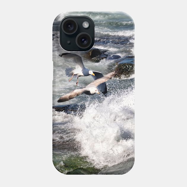 Seagulls flying over the crashing waves, Seahouses, Northumberland, UK Phone Case by richflintphoto