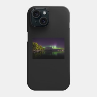 Northern lights glowing over lake in Finland Phone Case