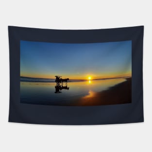 A silhouetted horse-drawn carriage on Parangtritis beach at sunset 2 Tapestry