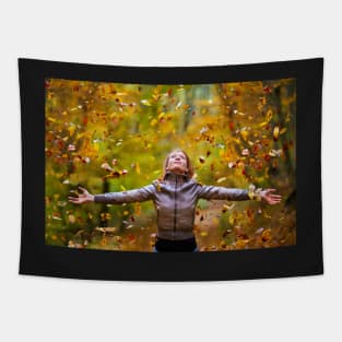 Young lady throwing up leaves Tapestry