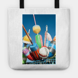 Collection of colorful fishing or lobster trap buoys and markers at wharf in Provincetown, Massachusetts, USA  Looks great on a sticker and even better as a canvas print on your wall. Tote