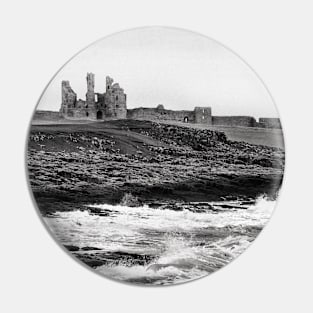 Waves along the rocky coast near Dunstanburgh Castle, Northumberland, UK Pin