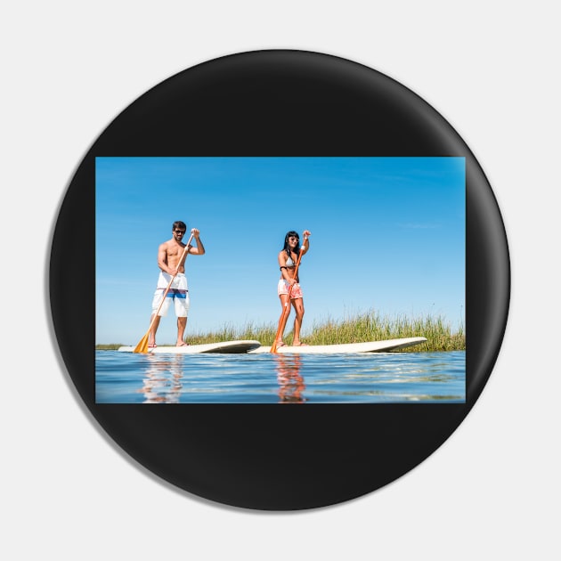 Man and woman stand up paddleboarding Pin by homydesign