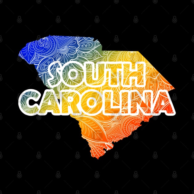 Colorful mandala art map of South Carolina with text in blue, yellow, and red by Happy Citizen