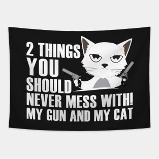 2 things you should never mess with!My gun and my cat Tapestry