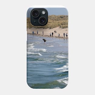 people on the beach at Bamburgh - Northumberland, UK Phone Case