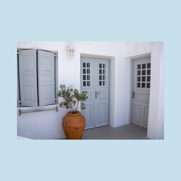 Two blue doors and shutters in Greek house. by sma1050