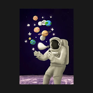 An astronaut on the moon plays with the planets like soap bubbles T-Shirt