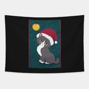 Cute Christmas card with a little kitten in a Christmas hat looking at a bauble. Tapestry