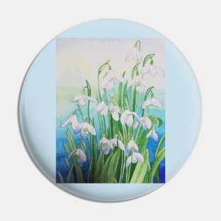 Snowdrops watercolour painting with a blue background. Pin
