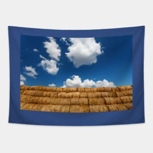 Bales of straw under blue cloudy sky Tapestry