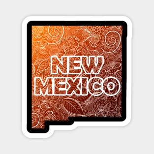 Colorful mandala art map of New Mexico with text in brown and orange Magnet