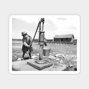 Girl Pumping water in Puno Peru Magnet