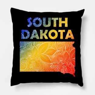 Colorful mandala art map of South Dakota with text in blue, yellow, and red Pillow