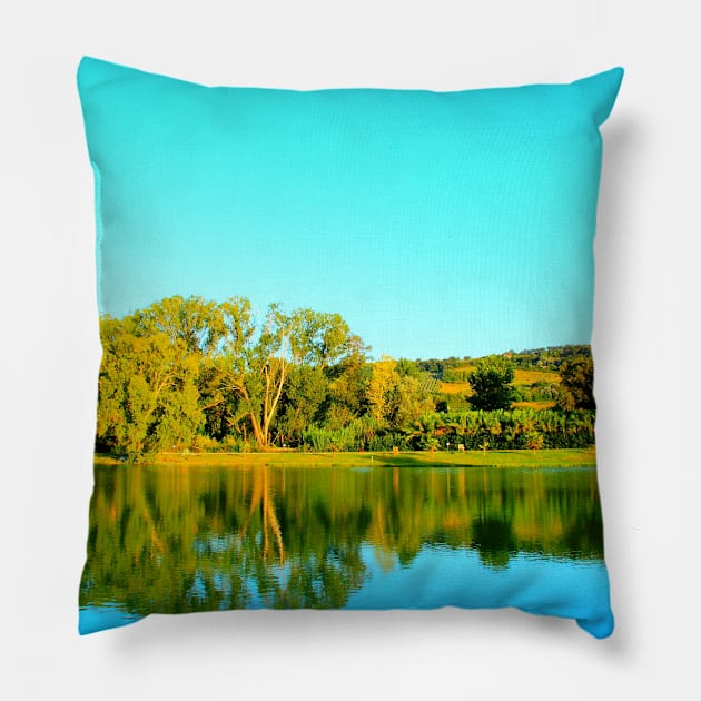 Scene from Lago Cedri in Lapedona with trees bathed in sunlight and the calm waters of the lake reflecting that lushness Pillow by KristinaDrozd