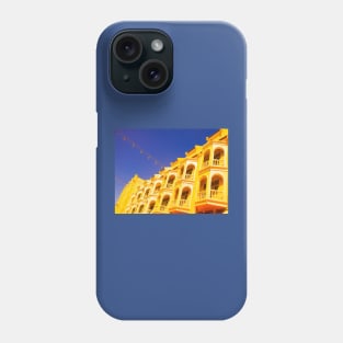 Yellow ancient floored facade against blue sky Phone Case