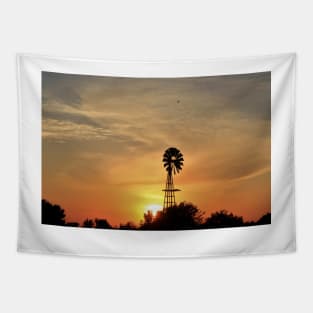 Kansas colorful Sunset with a Windmill silhouette and a bird in the sky. Tapestry