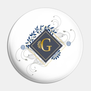 G, blue and gold initial monogram. Pin