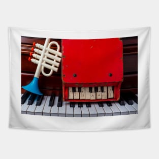 Toy Trumpet And Red Piano Tapestry