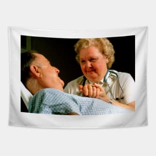 Geriatric care: elderly man reassured by nurse (M540/0193) Tapestry