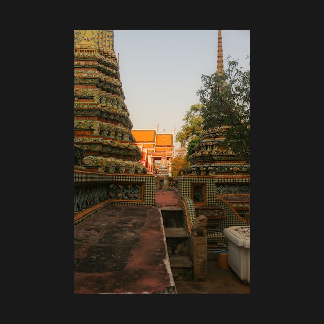 Second sidewalk view to ornate roof, flanked from parts of Chedis at Wat Pho. by kall3bu