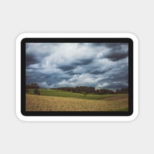 Stormy cloudscape over fields and pasture Magnet