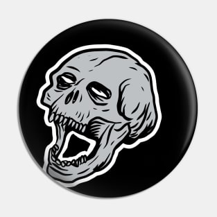 Skull head with blank, soulless eyes. Pin