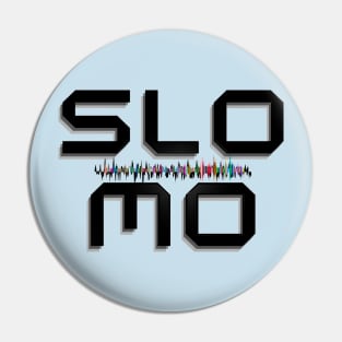 Word SloMo (slow motion), laminated in black with an audio signal in the center. Pin