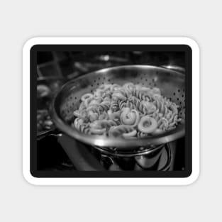 Pasta draining in a colander Magnet