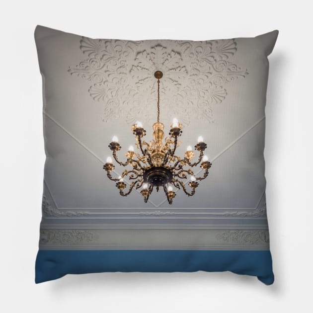 golden chandelier suspended down a ornate ceiling Pillow by psychoshadow