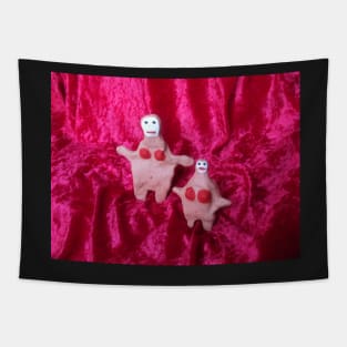 Two Clay Women on Red Velvet Tapestry