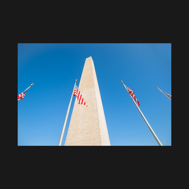 Washington Monument tall obelisk in National Mall Washington DC commemorating George Washington with flags by brians101