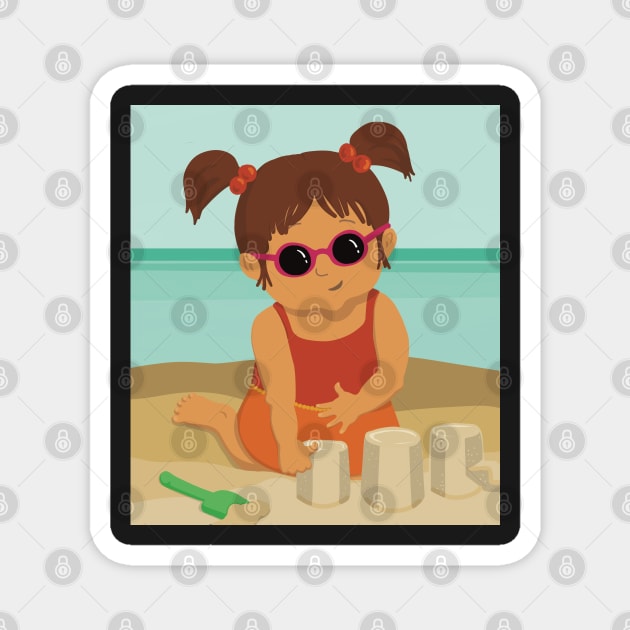 Cute little summer girl is on vacation building a sand castle on the beach Magnet by marina63