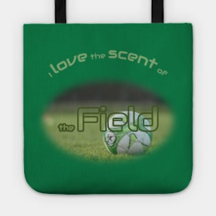 Green soccer ball in the field Tote