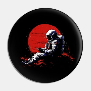 astronaut with a mobile phone sitting on the top of a hill Pin