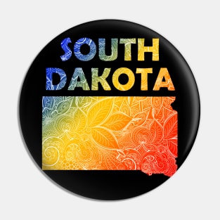 Colorful mandala art map of South Dakota with text in blue, yellow, and red Pin