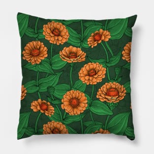 Orange Zinnia flowers, green leaves on dark green Pillow