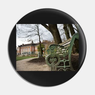 A bench in the park with a background of  South Hill Park Arts Centre, Bracknell, England, UK Pin