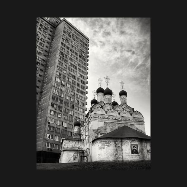 Black and white photograph of Russian orthodox church with spires and public highrise housing project in the background. Moscow, Russia by Reinvention