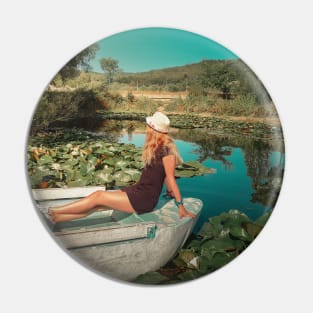 woman floating among waterlilies Pin