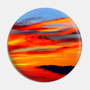 Breathtaking red sunset on the blue sky with weird clouds Pin