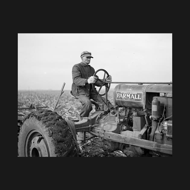 Farmer Driving Tractor, 1937. Vintage Photo by historyphoto