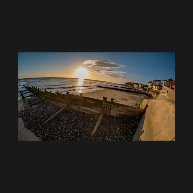 Fisheye view of wooden groynes on Cromer beach at sunrise by yackers1